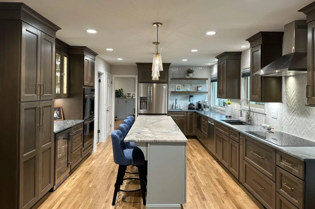 Modern Kitchen with Dark Wood Cabinetry and Marble Island