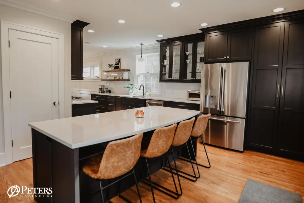 “Contemporary kitchen featuring open shelving, marble island, and stainless steel range hood.”